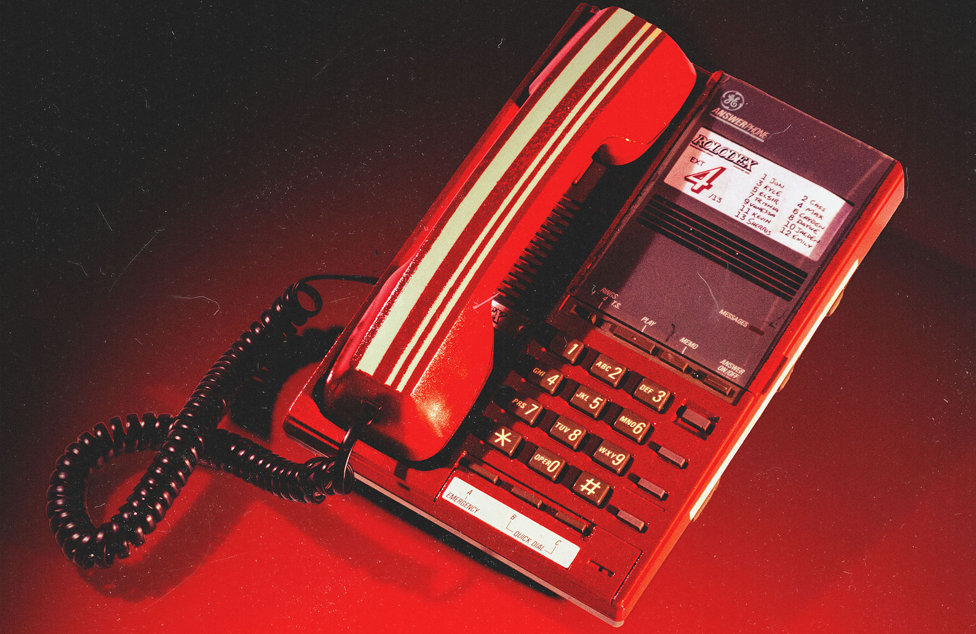 A Photo of a red telephone.